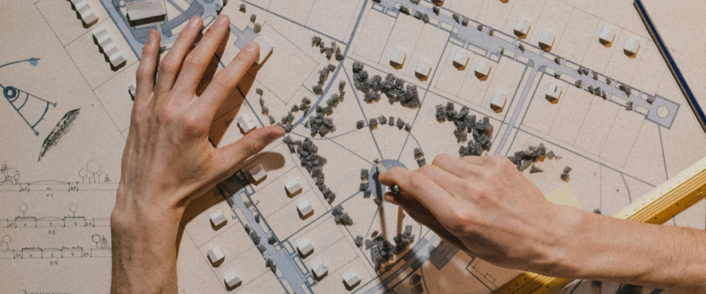 Hands on an architectural drawing